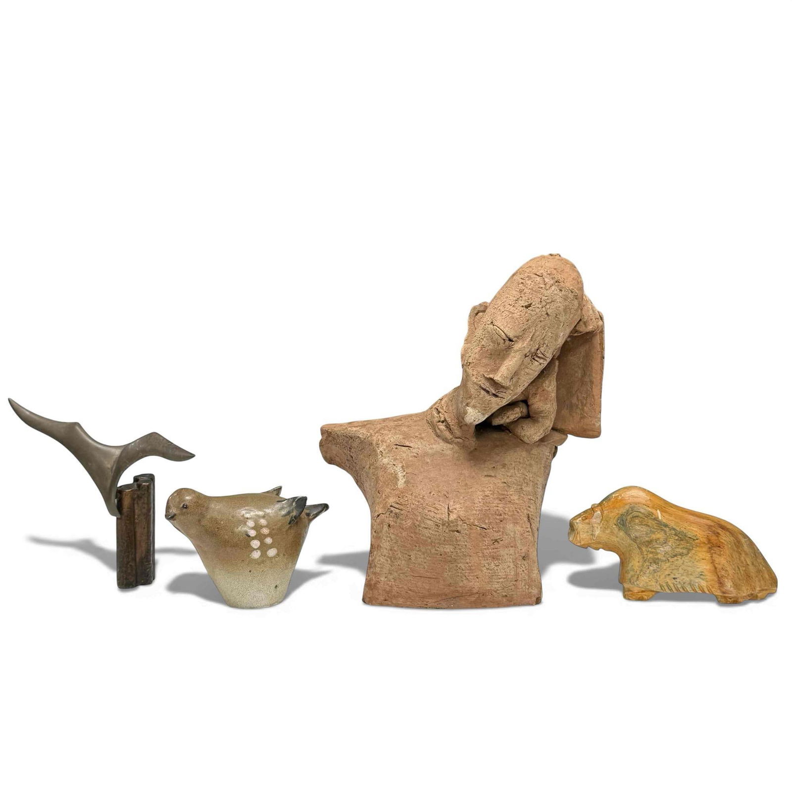 Studio Art and Sculpture Lot: Thomas Kakinuma art pottery, brown glaze sparrow with white spots. Brass wood dock post with seagull sculpture signed "Dewey" measures approx 6.5" tall by 8" wide. Carved stone or possibly petrified w