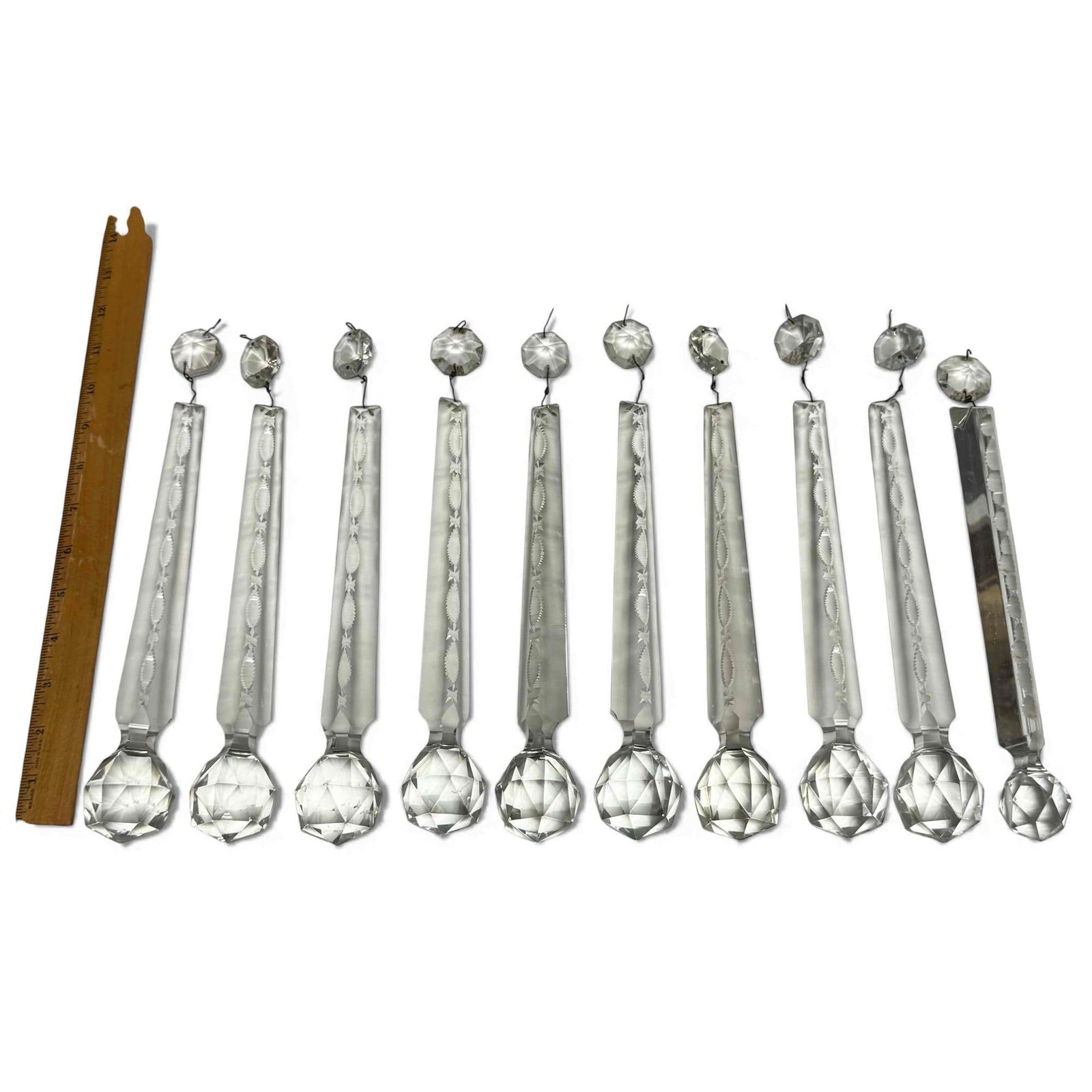 Cut Crystal Chandelier Spear Prisms 12" Long (10): Set of nine cut crystal chandelier spear prisms with one a different pattern. Having faceted spear shape with rounded faceted ball on base. Measuring approx. 10" long main body and 12" overall. In goo