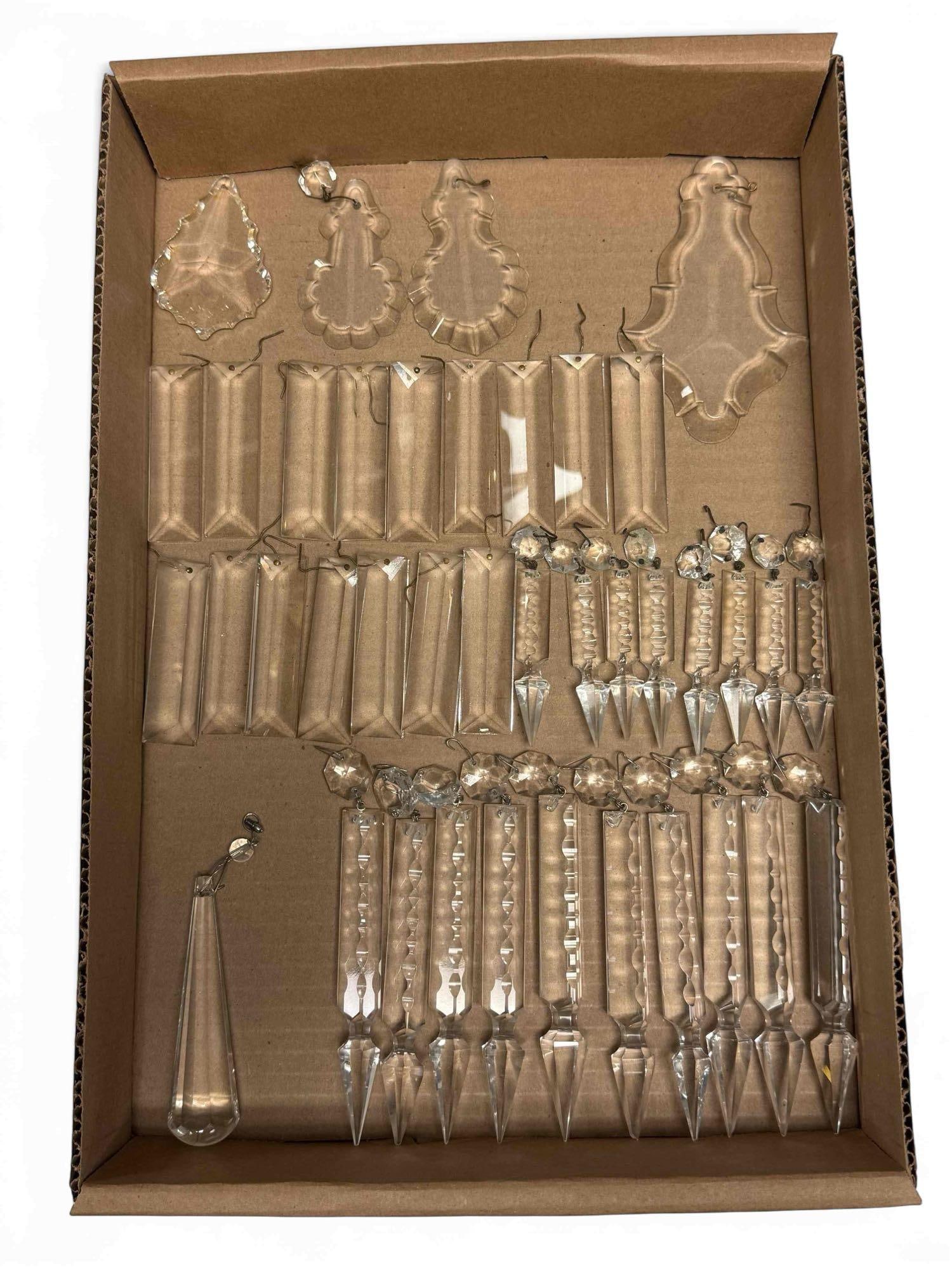 Various Styles of Chandelier Crystal Prisms (39): Various shapes and styles of crystal prisms including; 10 two tier spear prisms 6" total length, 8 two tier spear 4" long, 16 square pendant 3" long and 4 beveled scalloped edge 3" to 5" long. In good