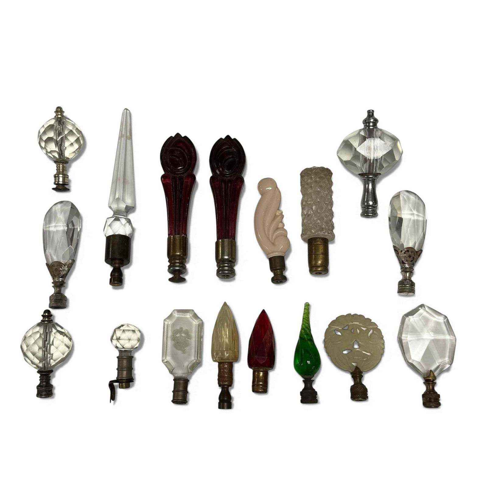 Large Collection of Glass Finials (17): Collection of 17 finials of various shapes and sizes. Colored glass, cut crystal, jade or stone. Set includes a matching pair of ruby glass finials these are the tallest in the lot and measure approx