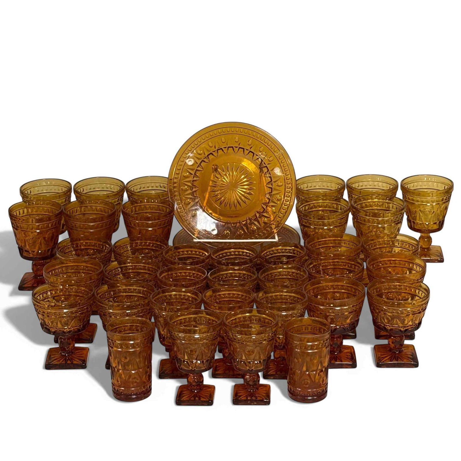 Indian Glass "Colony Park Lane" Amber Glassware Dishes: Indian Glass Co. "Colony Park Lane" amber glassware Includes; 8 - 8.5" Salad Plates (1w/small chip) 11 - Water Goblets 5.5" x 3.5" 9 (no damage) 12 - Wine Glasses 4.5" x 3.5" (no damage) 11 - Cordials