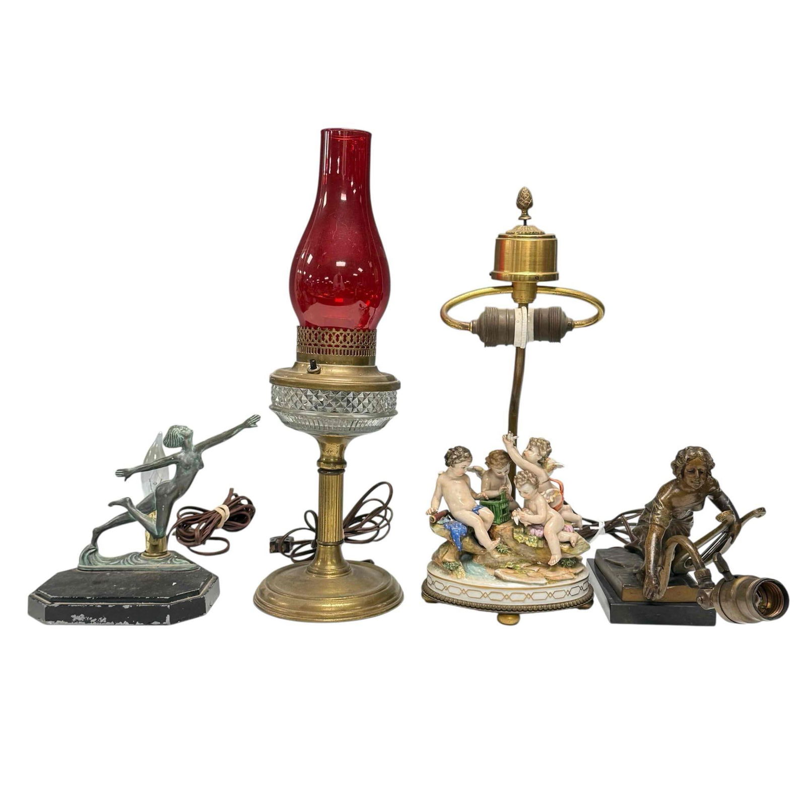 Cherub Figurine and Hurricane Lamps (4): Electrified tall Lincoln oil lamp with red hurricane chimney 18.25" tall, art deco figural nude woman patinated bronze lamp 7.25" tall by 6.75" wide base by 7.25" deep, art nouveau bronze finished fig