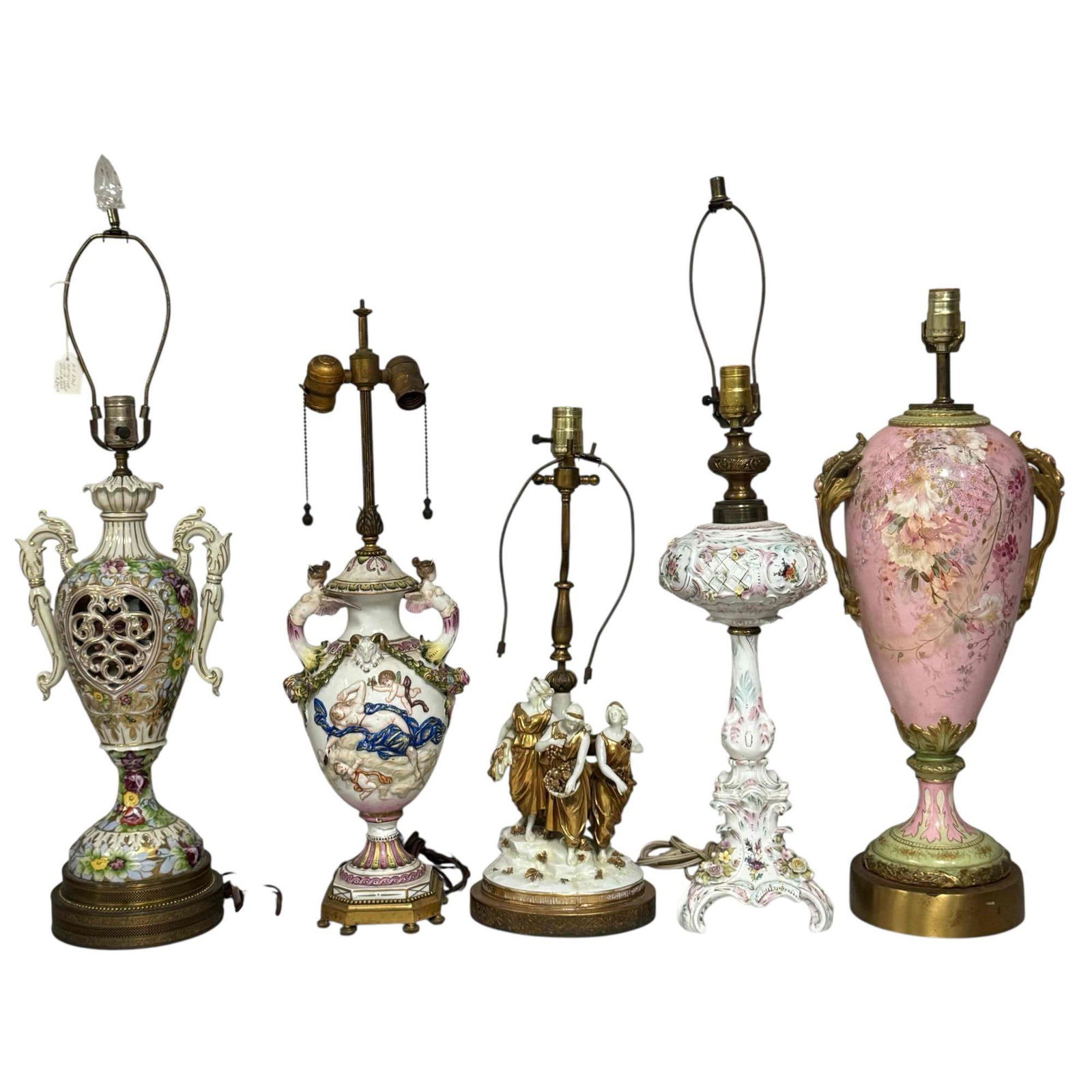Figural Porcelain Lamps Grouping (5): Including; Capodimonte mythological nude women, rams heads, floral garland and cherubs lamp on eight footed adjustable brass base 25.5" tall, very heavy 12lbs 10ozs with one broken wing on woman handl