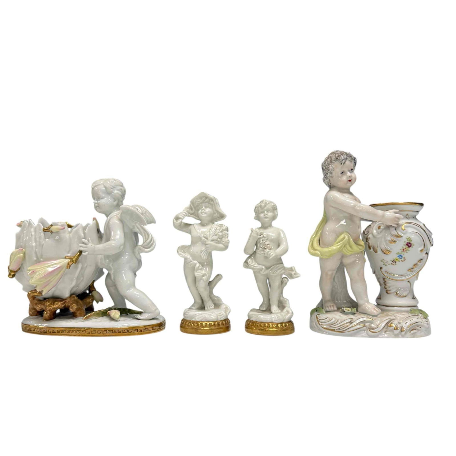 Porcelain Collection Lot: Cherub compote or vase with floral and gold trim measures 8" x 8" x 6". Marked with Sitzendorf Voigt Brothers mark and stamped m-455 on bottom. Flower broken of the front, see photos. Cherub holding a