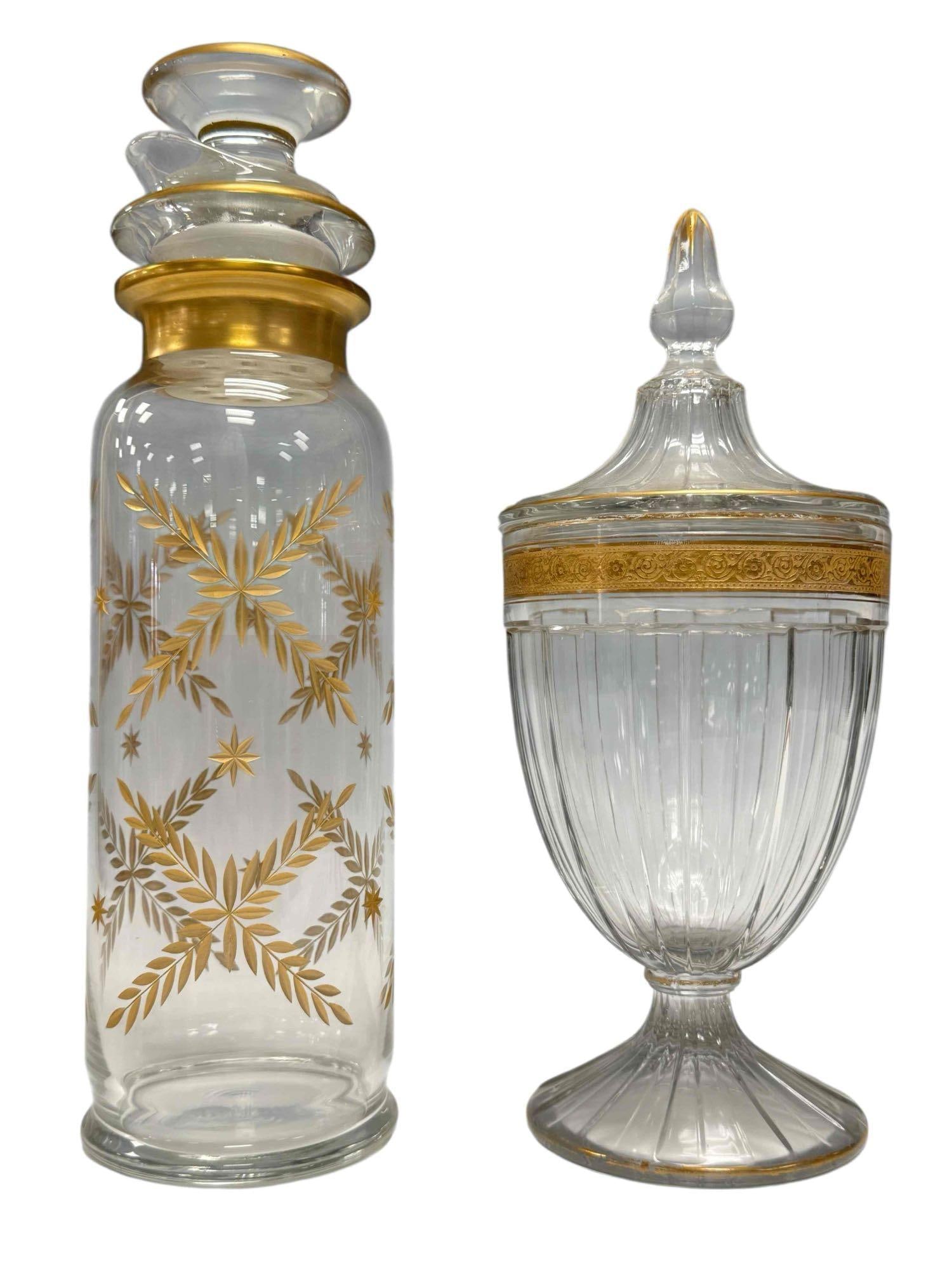 Heisey Gold Etched Lidded Jars and Cocktail Shaker: Heisey footed candy jar with gold Minton band and recessed panel design. Measures 11" tall x 4.5" wide. Has some gilt loss around the rims but overall in good condition, see photos. Heisey 3-piece cob