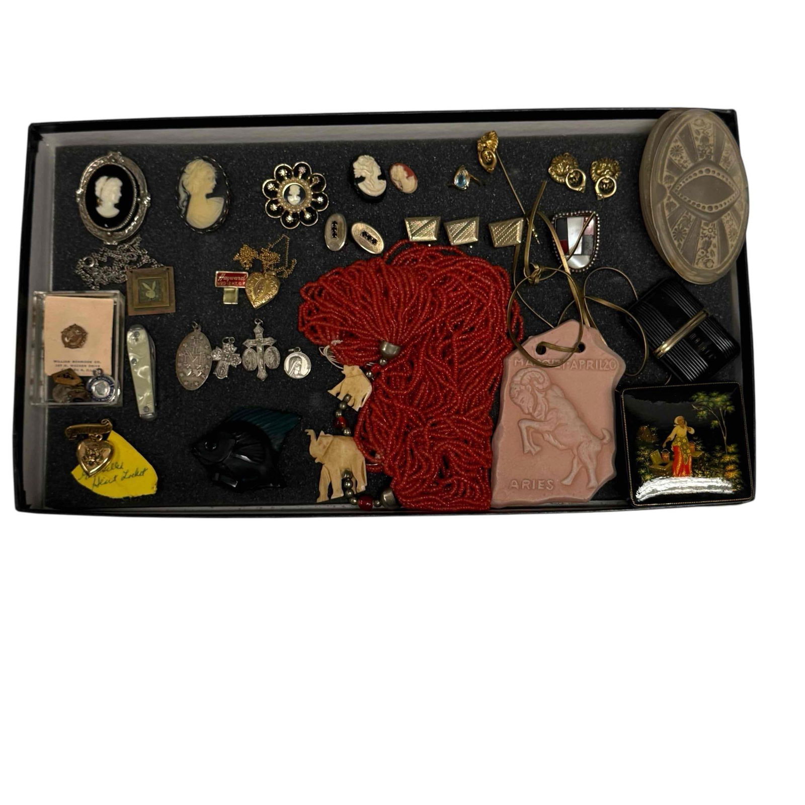 Sterling Silver 10K Gold with Costume Jewelry & More: 10k gold heart locket and chain 4.1 grams, sterling crosses and religious pendants, red coral bead necklace with carved elephants, cameo brooches, Lalique turquoise fish 1.75" tall, cuff links, trinke