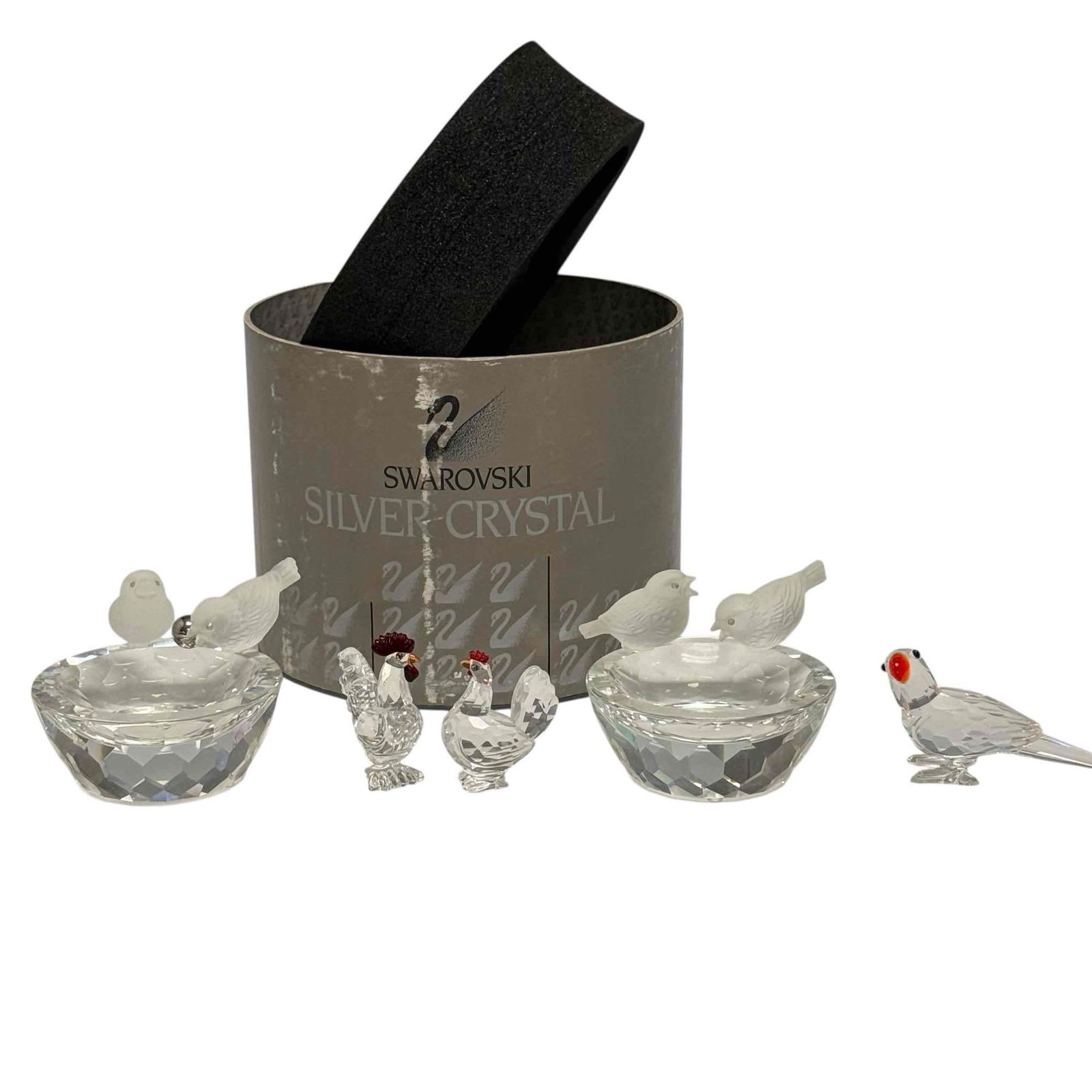 Swarovski Crystal "Bird Bath" and Bird Figurines (5): Two Swarovski "Bird Bath" or Bird Feeder" trinket bowls 2.25" tall by 3" wide, "Feathered Beauties" collection parrot 3" long and rooster & hen figurines 1.75" to 2" tall. In good condition with n