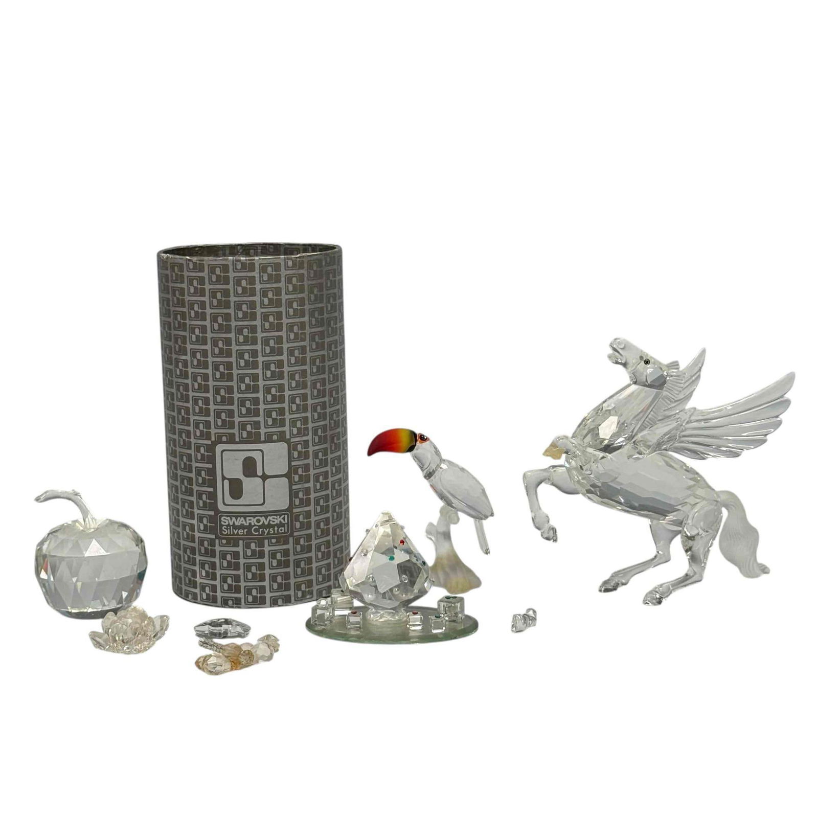 Pegasus Toucan and Other Swarovski Crystal Figurines (7) (As-Is): SCS Swarovski crystal Pegasus 4.75" tall with severed front leg, faceted apple 2.5" tall appears to be missing leaf from stem, Toucan part of the "Feathered Beauties" collection 3" tall, heart cluster