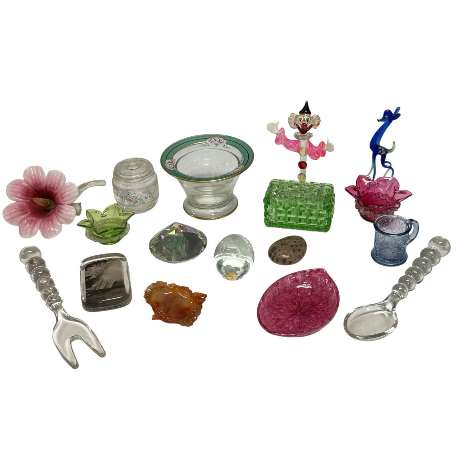 Art Glass Figurines Utensils Paperweights Uranium Glass and More: Grouping includes; hand blown glass clown 5.25' tall, blue giraffe 5" tall, opalescent flower 6.75" long, paperweights, clear glass salad utensils 9.75" long, uranium glass lidded box 2" tall, trinket