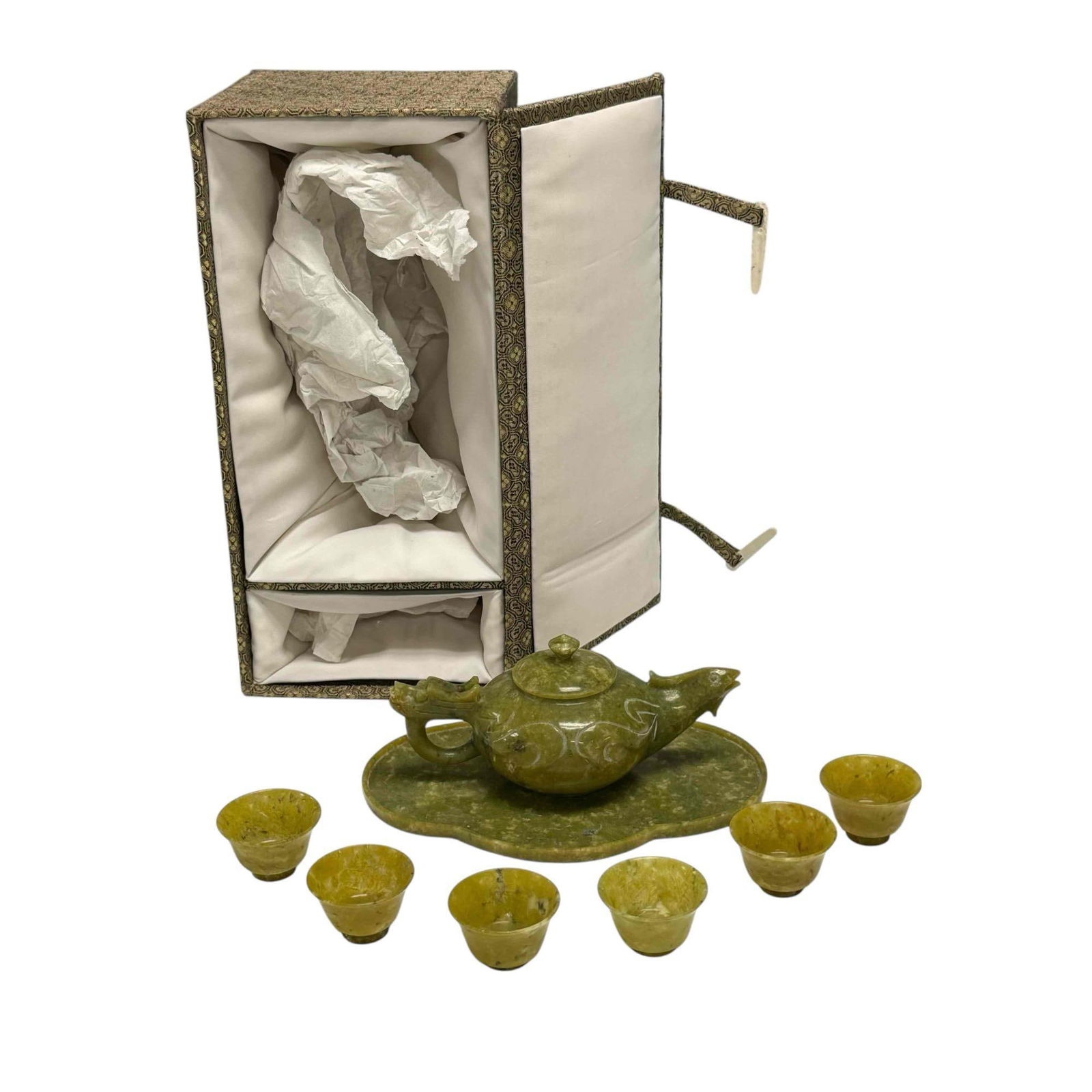 Chinese Carved Jade Tea Set Service For Six (8): Carved green spinach jade tea set includes lidded teapot with dragon head handle and rooster spout 2.5" tall by 6" long, oval form tray 6.75" long and six cups 1" tall all inside fabric wrapped storag