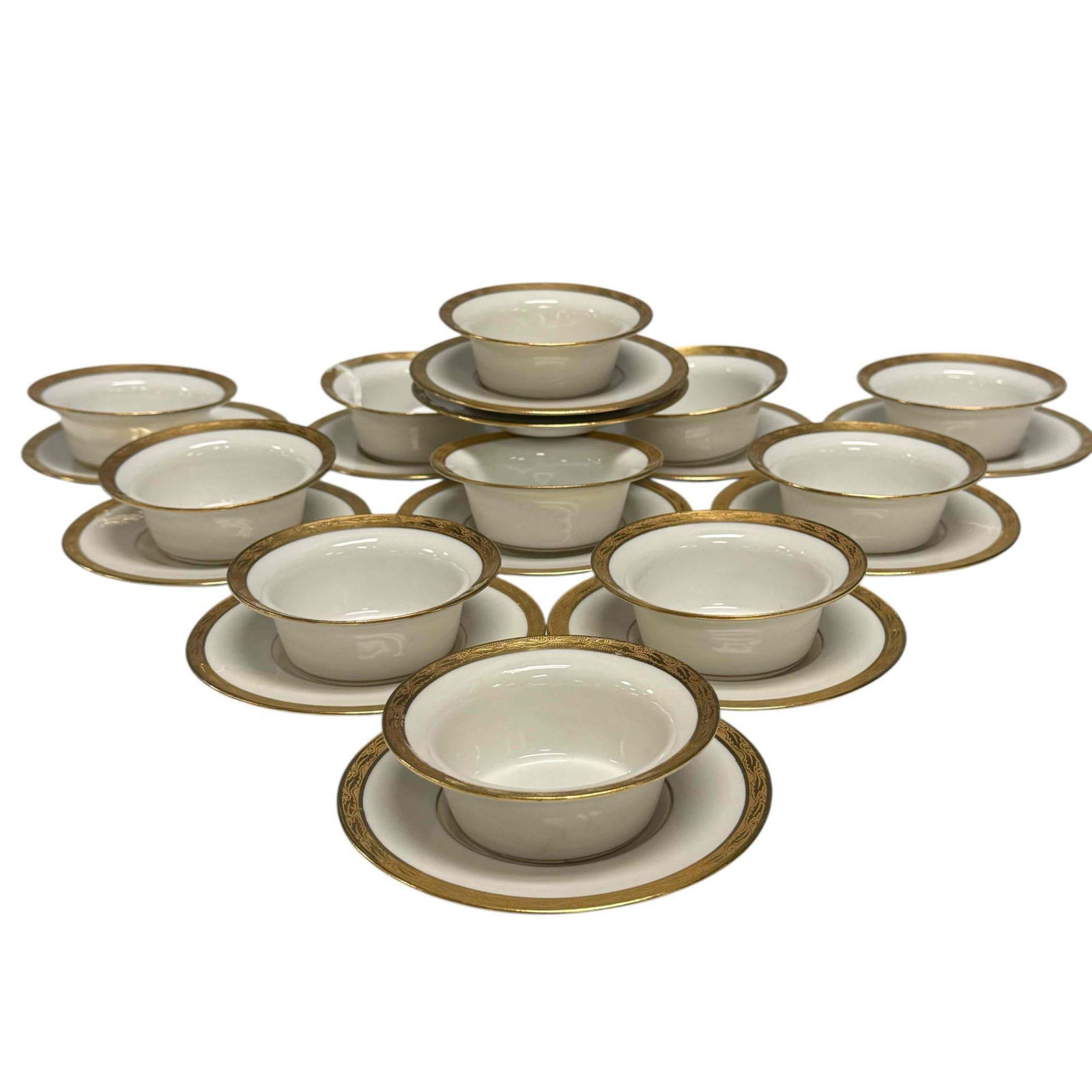 Limoges France Ramekins & Underplates: Consisting of 11 bowls and 12 under plates with encrusted gold enamel design boarders. Stamped Limoges France Laurel with some in gold round logo, Condition very good no chips, Bowls 1 1/2'' x 4''.