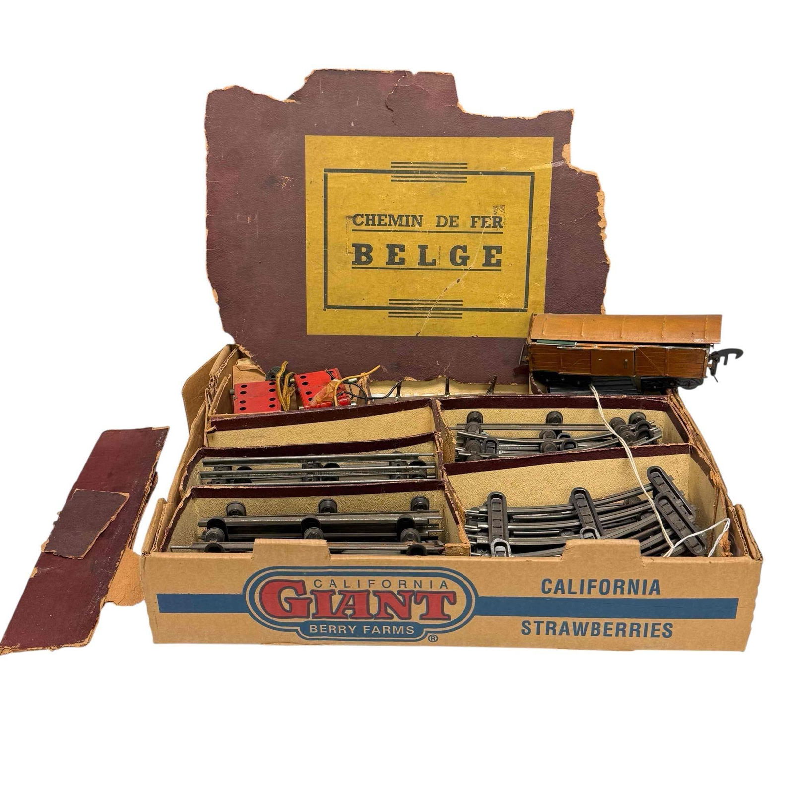 Belgian Railway "Chemin de Fer Belge" Tin Toy Train Set: Vintage Belgium Railway "Chemin de Fer Belge" tin toy train set in original box. Includes three train cars, transformer and track. Untested with box measuring approx. 19.5" by 14" having heavy wear, s