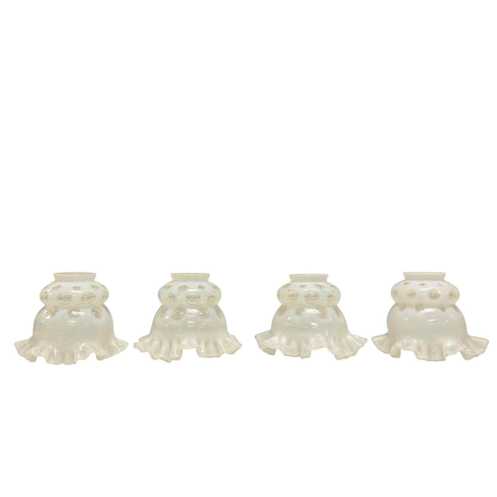 White Opalescent Coin Dot Ruffled Lamp Shades (4): Four likely Fenton white opalescent coin dot ruffled edge lampshades. Measuring approx. 4.5" tall by 6" base. In good condition with no breaks or cracks, see photos.