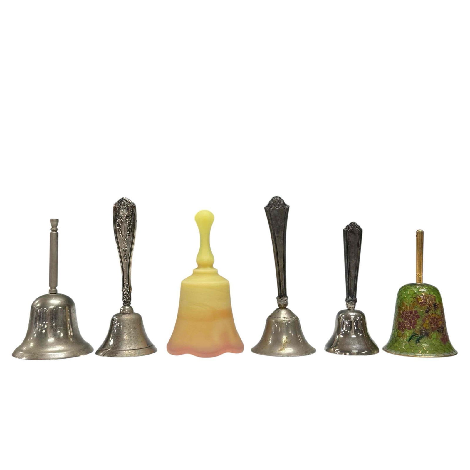 Art Glass Sterling Silver and Uranium Glass Bells (6): Includes; Plique-a-Jour translucent green glass metal work framed 3.75" tall, uranium custard glass 4.25", three sterling silver handled 4" to 4.75" tall stainless 4" tall. In age appropriate conditio