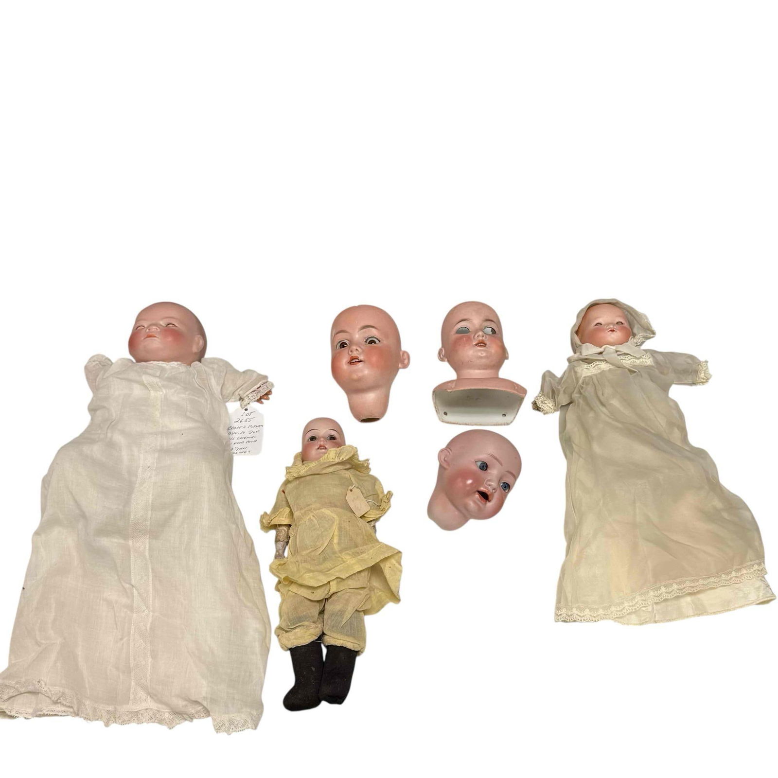German Porcelain Bisque Heads and Dolls (6): German porcelain dolls including; Armand Marseille, Grace S. Putnam and Kiddie Joy. Some have early bodies and sleepy eyes. Measuring approx. 3.75" to 5.5" tall heads. In age appropriate condition wit