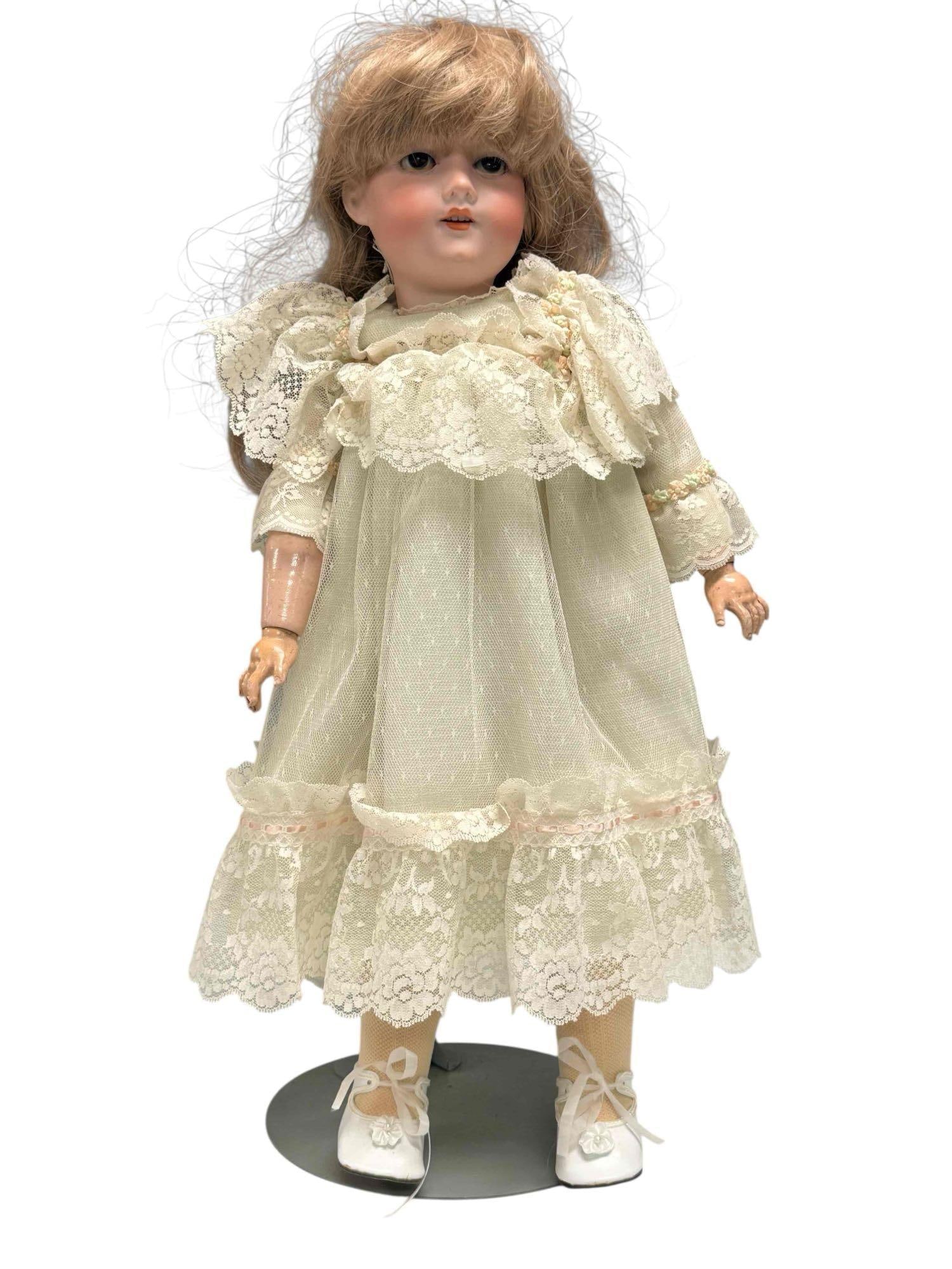 Armand Marseille Germany Porcelain Doll 390: Vintage German Armand Marseille porcelain doll. Stamped 390 and 6 1/2 on back of head. Measuring approx. 22" tall. Head in good condition with no breaks or chips noted, hands/body having chips and sig