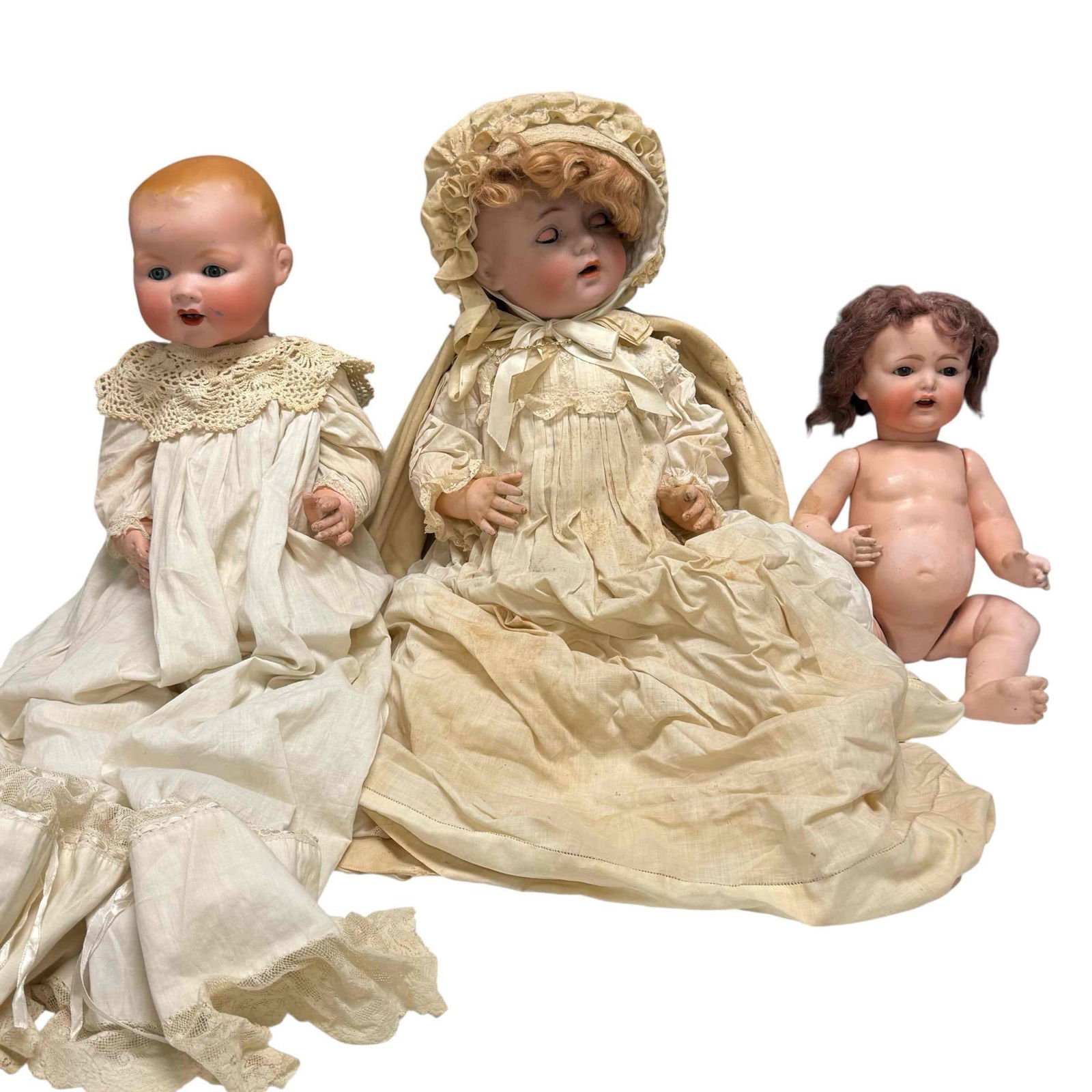 Bisque Porcelain Head Antique Jointed Dolls Simon Halbig Armand Marsille & Nippon (3): Three antique bisque porcelain jointed and sleep eye dolls. Including; Armand Marseille Germany 351/9K measuring approx. 26" tall with blue eyes, scuffs, some chips and rubbing mostly to body, Simon &