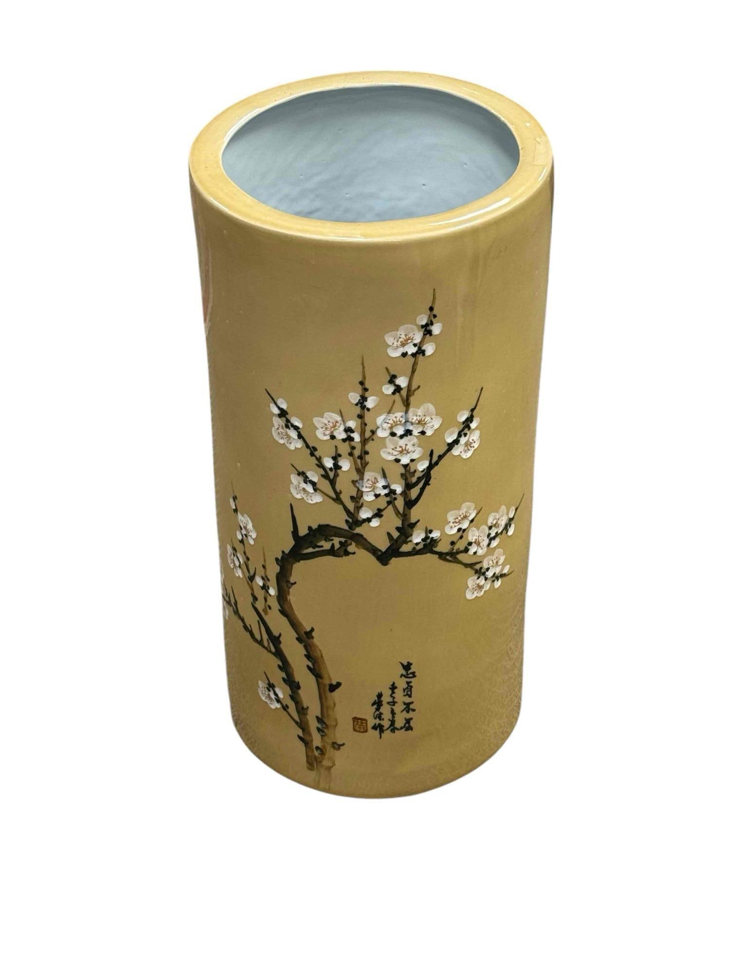 Yellow Ceramic Umbrella Stand / Floor Vase w/ Cherry Blossoms: Mid 20th century Asian inspired umbrella stand with standard high glaze finish and cherry blossom motif. Measuring approx 21" h x 10" x 10" diameter. No issues, very good and nice subtle neutral color