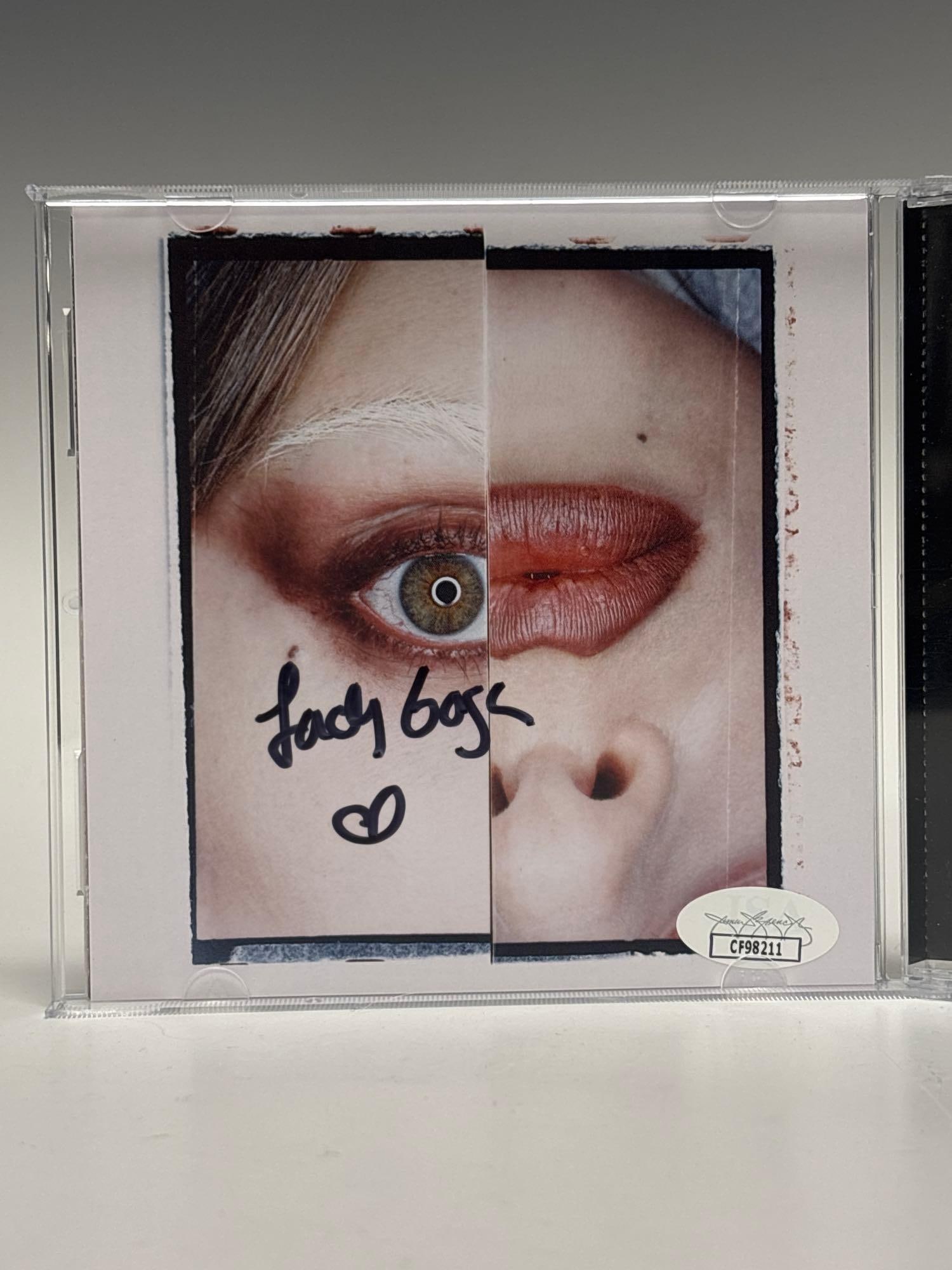 Lady Gaga Autographed Mayhem CD Insert JSA: Gorgeous black marker signature on the cd insert by the one and only Lady Gaga. Amazing singer and entertainer. JSA certified.