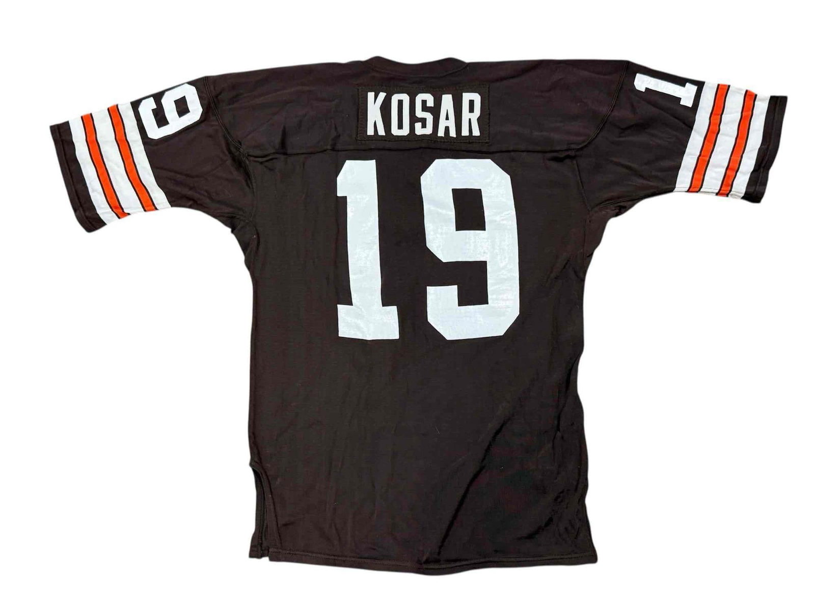 1980's Bernie Kosar Cleveland Browns Game Worn Jersey: Very rare 1980's size 46 Sandknit Cleveland Browns home jersey. Made to be worn on the field in combat as evident with the sewn on name plate and the tackle twill numbering and design. Not a lot of si