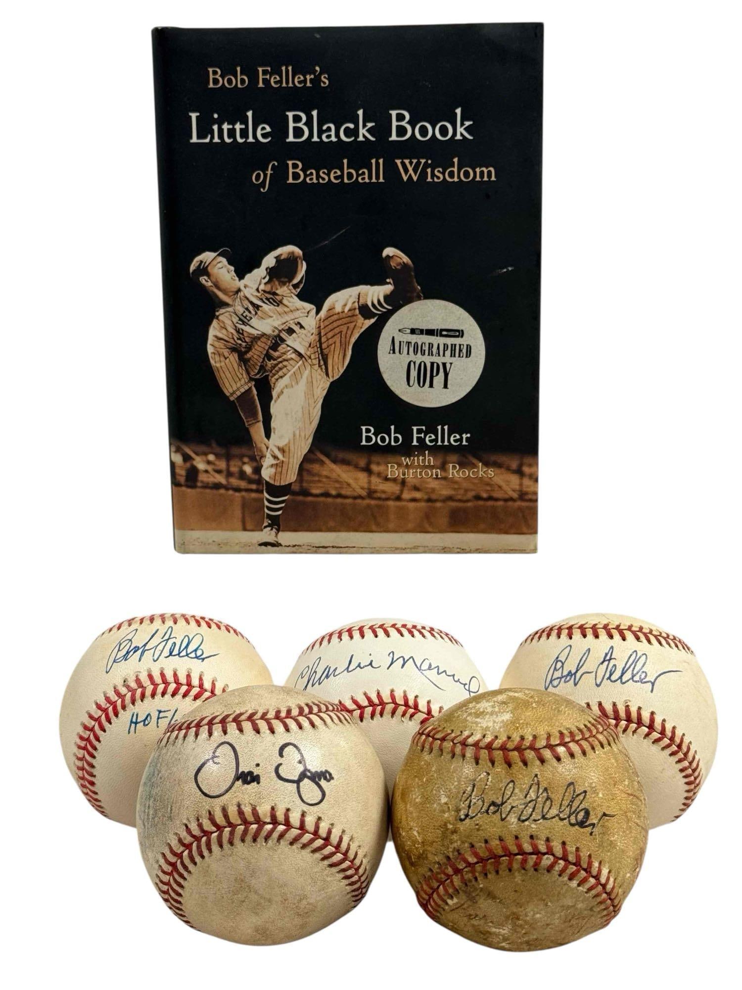 Cleveland Indians and Bob Feller Autograph Lot: A total of six autographs. Bob Feller's Little Black Book. The rest are baseballs. Travis Fryman foul ball signed in black sharpie along with a ticket stub for Sept 19th game in which Manny hit 2 HR a