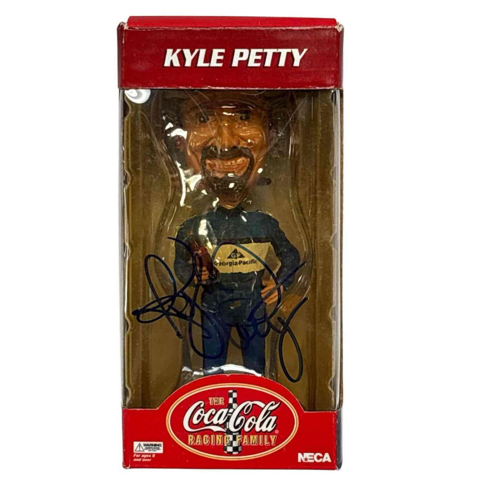 Kyle Petty Autographed Coca Cola Head Knockers Box JSA: Miniature bobble head new in the box. The racing legend signed on the plastic window of the box in blue marker. JSA certified.