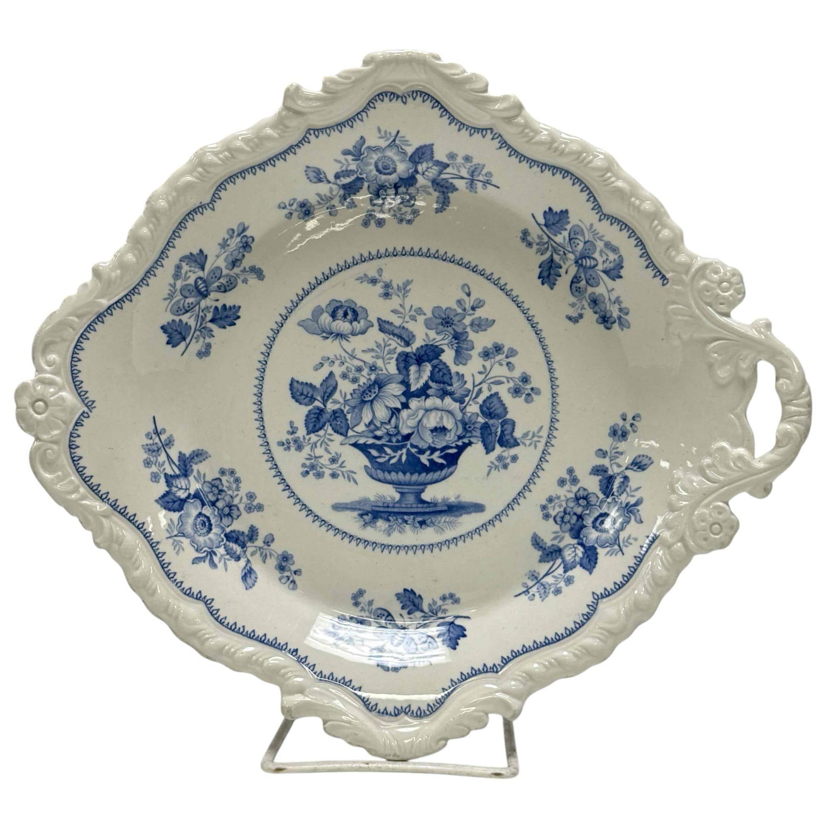 Circa 1815 Portland Basket Serving Platter by J and W Ridgway: Early 19th century J & W Ridgway blue and white porcelain transferware "Portland Basket" floral bouquet serving platter. Measuring approx. 10" long by 9" wide. In good age appropriate condition wi