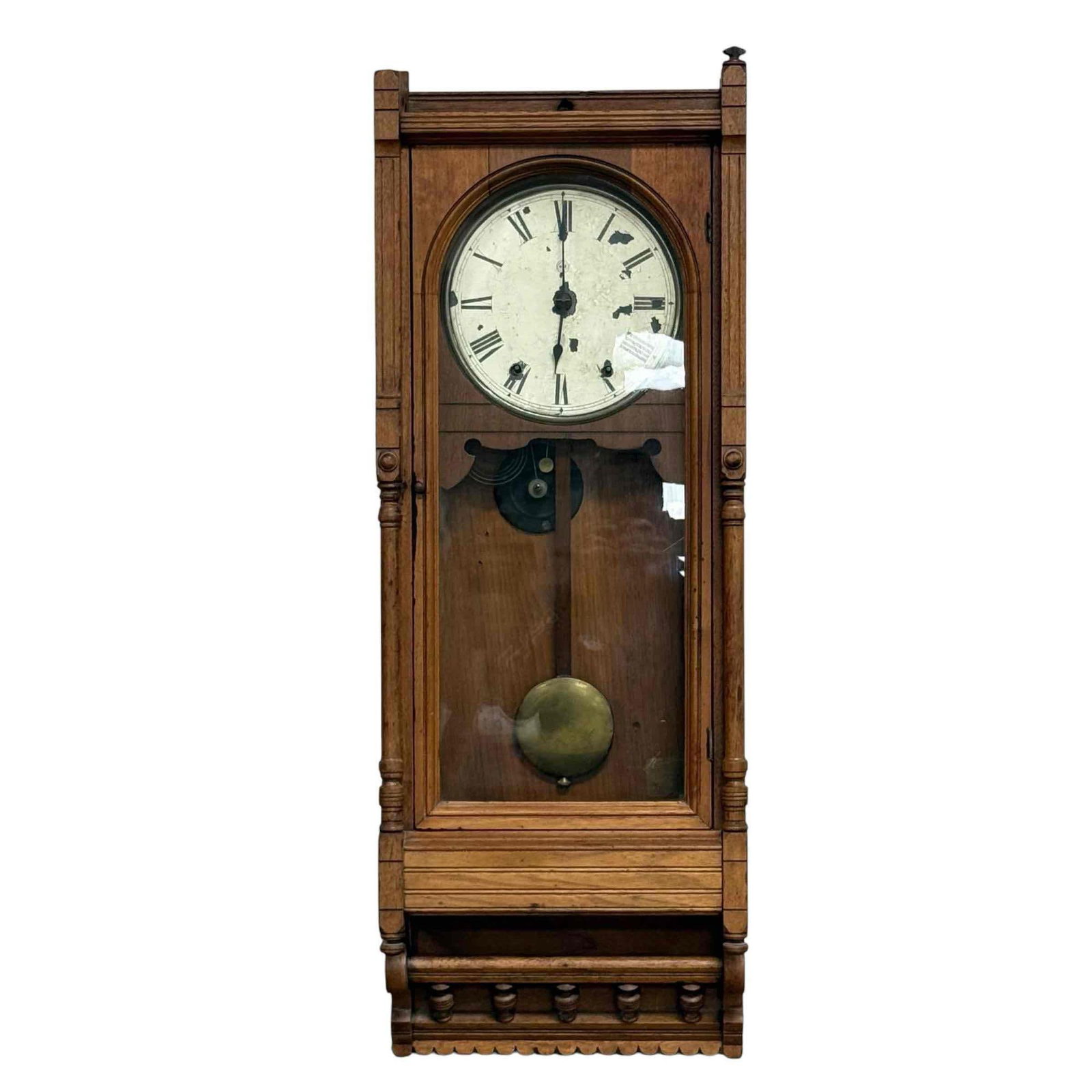 Hennegen Bates & Co Walnut Case Wall Clock: 19th century walnut cased wall clock with interior label as shown. Measuring 37" h x 13" w x 5" d. Some paint loses to dial and upper finial, as shown, see photos.