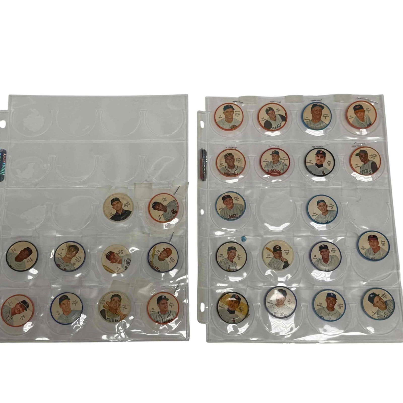 1962 Salada Tea and Junket Baseball Coins (27): Plastic coins with paper player inserts. Roberto Clemente, Hank Aaron, Gil Hodges, Curt Flood, Whitey Ford, Vic Wertz, Junior Gilliam, Ken Boyer, Elston Howard, Joe Torre, Bob Skinner and others.