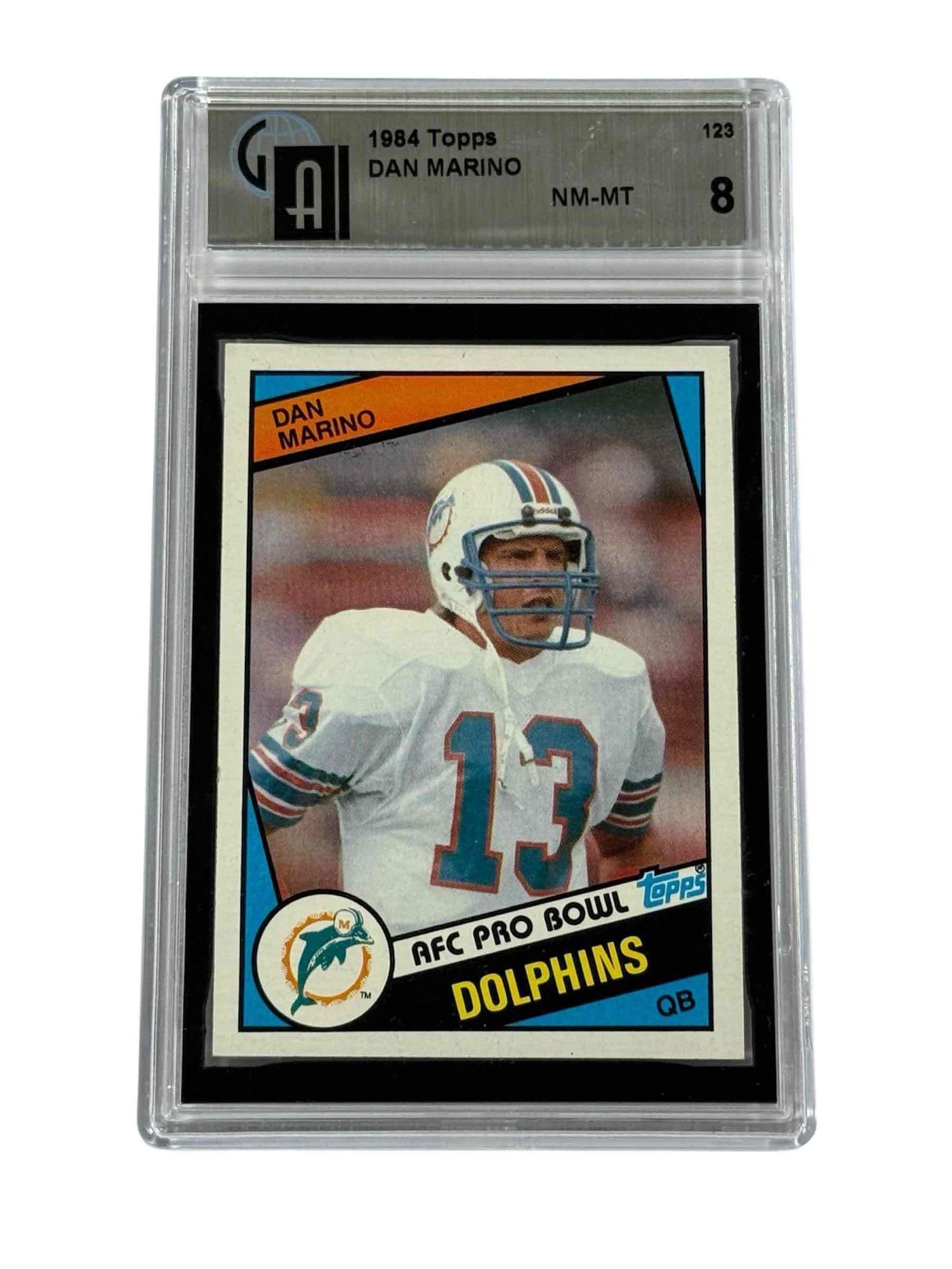 1984 Topps #123 Dan Marino Rookie Card GAI 8: NM-MT 8 grade by Global on the HOF QB rookie card.