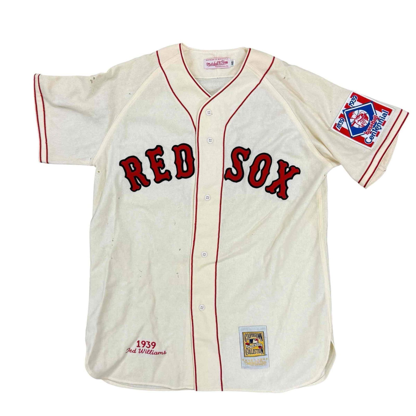 Ted Williams 1939 Throwback Red Sox Jersey Cooperstown Collection: Size 46 Mitchell and Ness jersey made to honor the 1939 season, his rookie season. There are a few holes in the jersey.