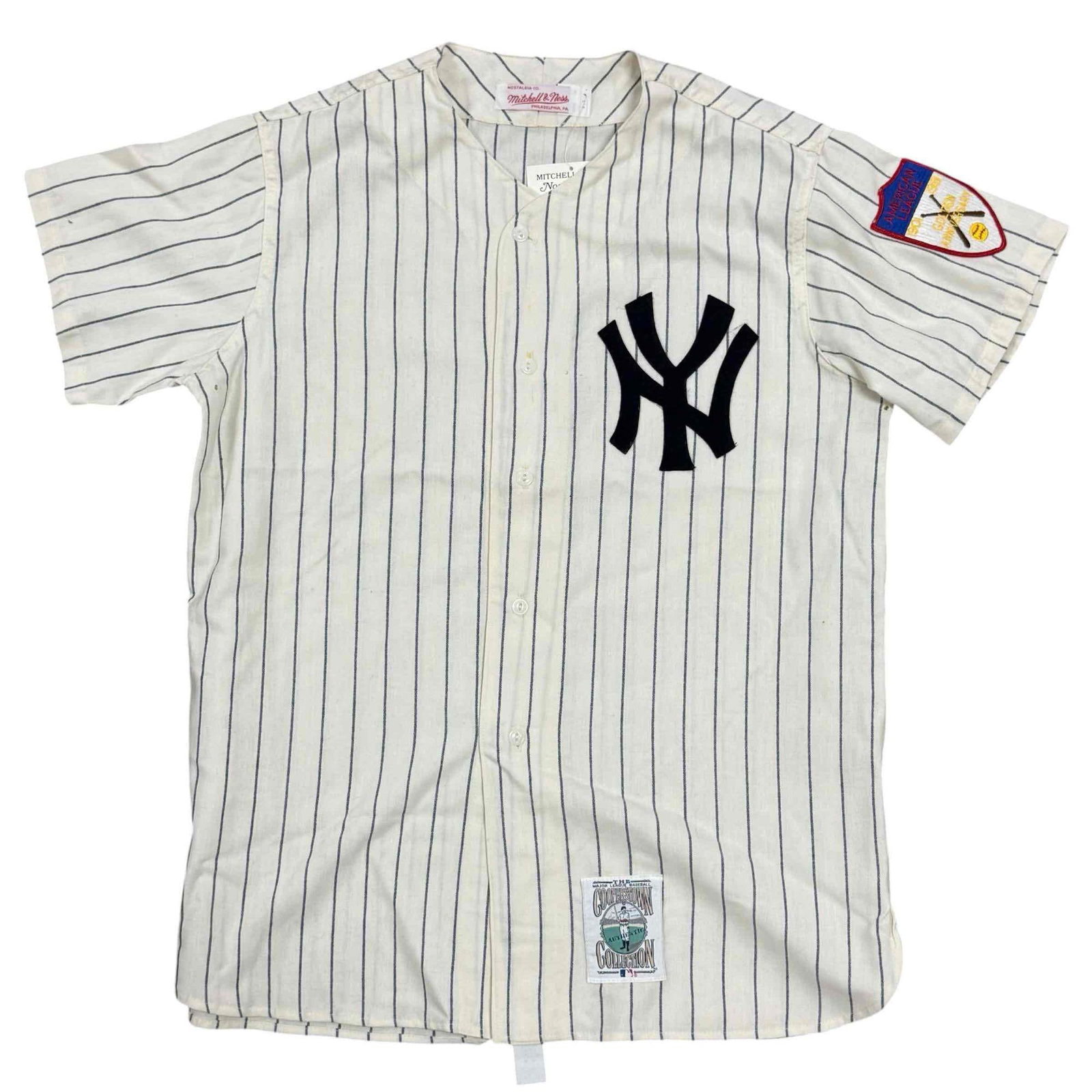 1951 Mickey Mantle Throwback Mitchell & Ness Rookie Year Yankees Jersey: This is an older Mitchell & Ness jersey. Probably from the late 1980's. Does not have a size on it, but is probably a Large. Patch for the 1951 season on the sleeve. Mick's infamous number on the 