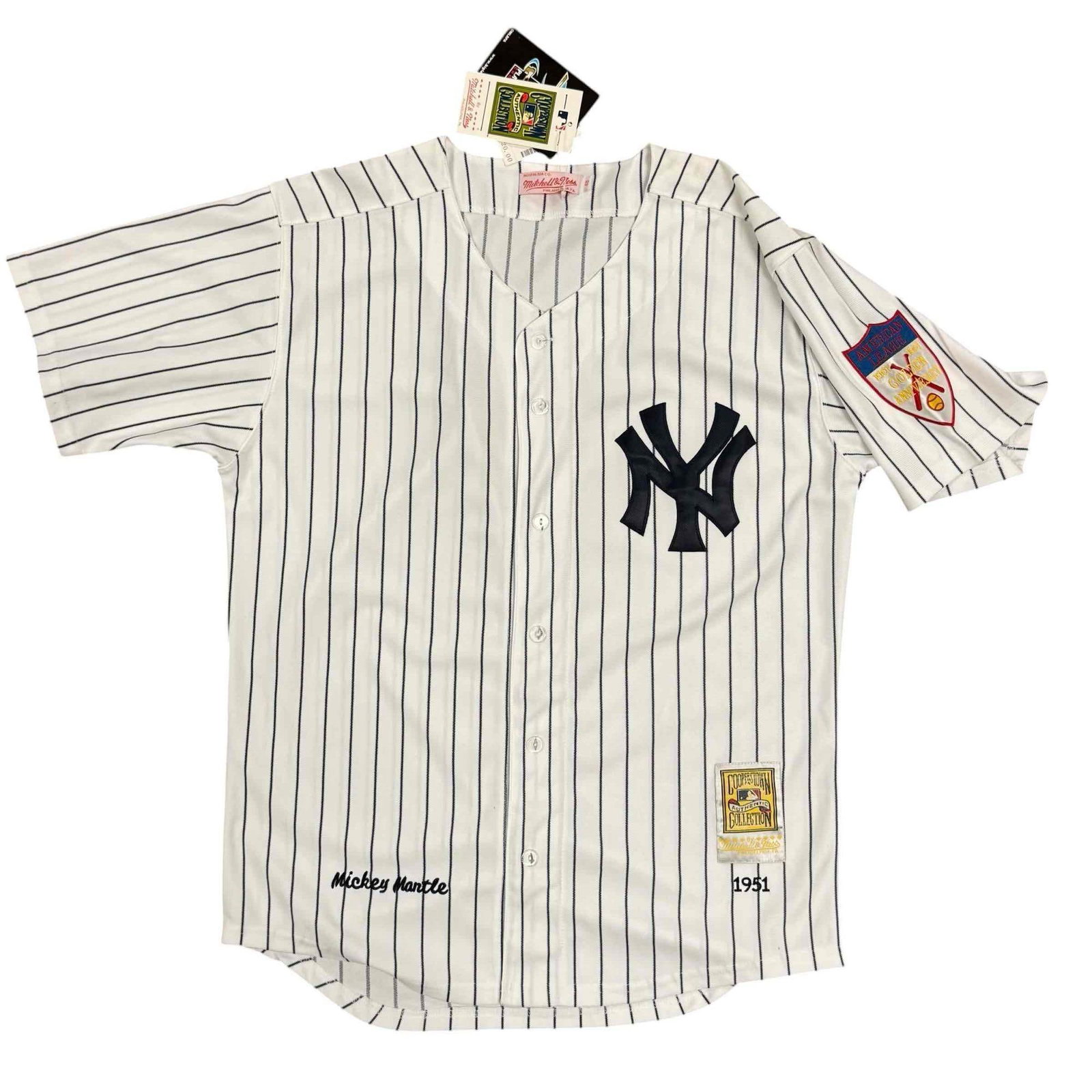 Mickey Mantle Mitchell & Ness Cooperstown Collection 1951 Throwback Jersey: Size 48 jersey commemorating the rookie season of the New York Yankee icon. Pinstripe jersey with 1951 patch on sleeve.