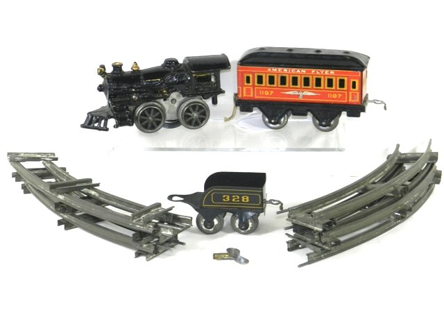 American Fulter Train Set: with cast iron clockwork engine tender and tin passenger car complete set in original box excellent condition