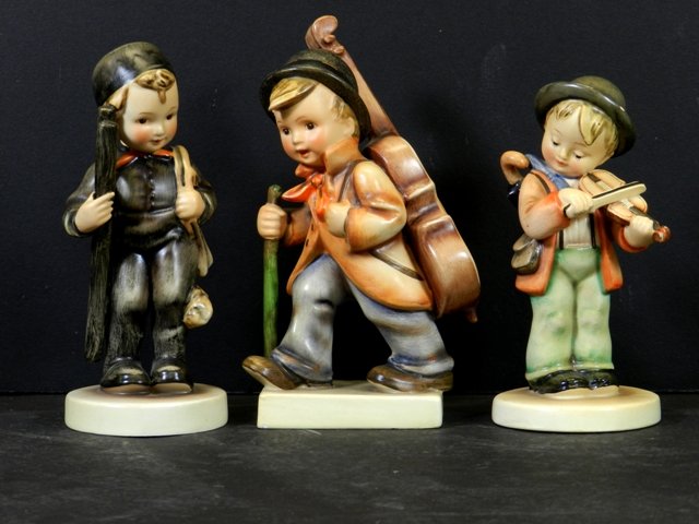 3 Early Hummel Figurines TMK-2: Including one TMK-1 #4 Little Fiddler 5" tall, #12 Boy with ladder 5.5" tall and #89 Little cellist 6" tall and all in good condition.