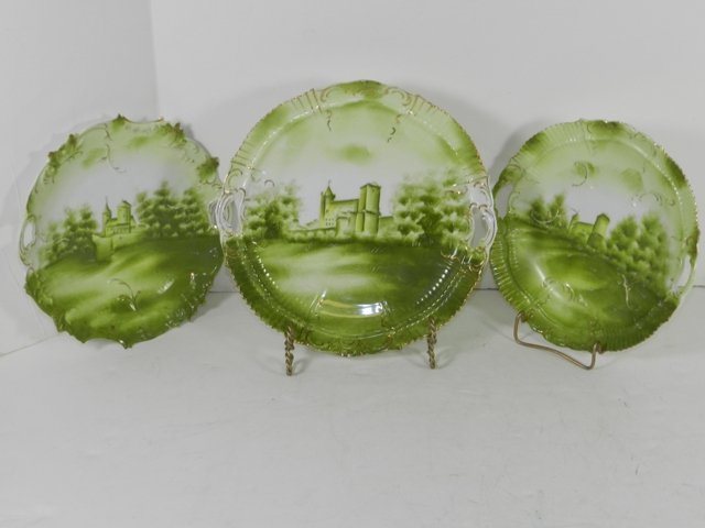 3 RS Germany Castle Plates: 3 Unmarked RS Germany castle plates with main green base colors, hand painted and gold gilt trim. Minor surface wear.