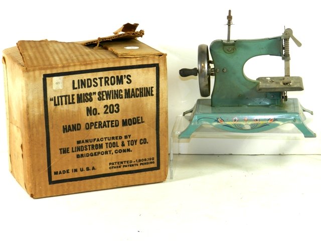 Lindstrom's "Little Miss" Sewing Machine No. 203: Lindstrom's "Little Miss" Sewing Machine no. 203 in very good condition containing its original box.