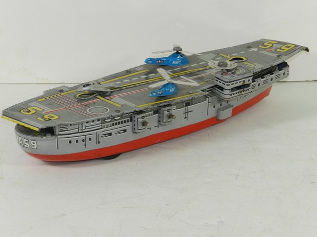 Japan Tin Litho Friction Aircraft Carrier: Japan Tin Litho Friction Aircraft Carrier Approx 12". Good condition 1960's.