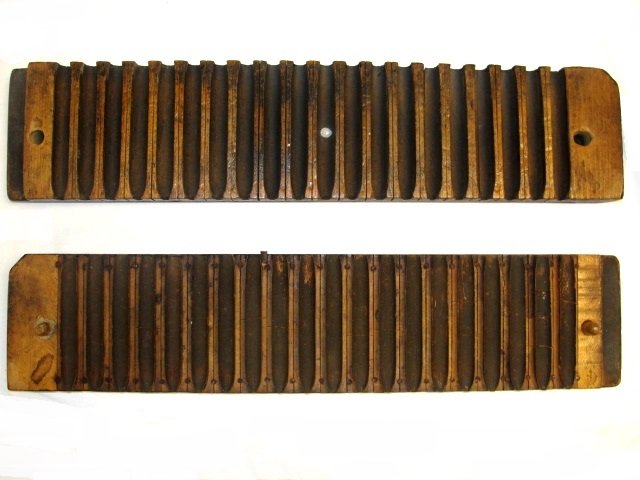 Late 19th. American Cigar Roller Pressing Mold: Having 20 spaces. Condition very good appropriate wear for age usage. Appears to be mahogany wood with a walnut finish. H. 2 1/2'' L. 22'' D. 5''.