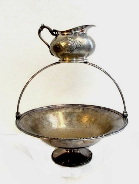 French Christofle Plated Basket And Cream Jug: Gothic Knot Handle Creamer having intermediate Christofle mark 1862-1935 for silver-plating, # 6 and Christofle in block. Monogram on both sides. Condition dent in one side by monogram. H. 3''L. 5 1/2