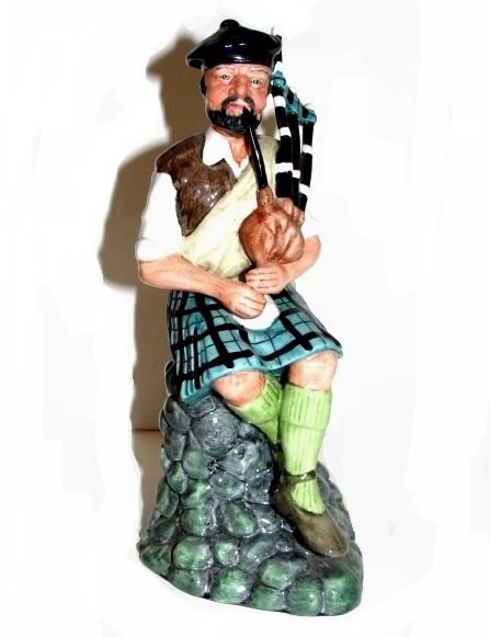 Royal Doulton Figurine The Piper HN 2907: The Piper' designed by M. Abberley, and issued in 1980, retired in 1992. Condition perfect no chips or cracks. 8'' Tall.