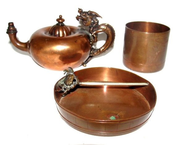 Gorham Co. Copper Miniature Teapot, Cup & Dish: All marked Gorham Co. with anchor mark. Oil lamp Aladdin form teapot with brass dragon handle marked Gorham Co.# 147. Condition overall very good, missing smoke snuffer with a few light dents. 2 3/4''