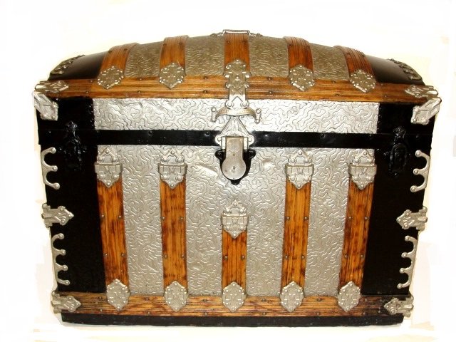 Martin Maier Dome Top Trunk Detroit Michigan: Ca. late 19th. Early 20th. C. marked with "M" and six across with double "M's". It is loaded with hardware, including cast iron fingering all around and his patented cast iron hinges. It also has a ra
