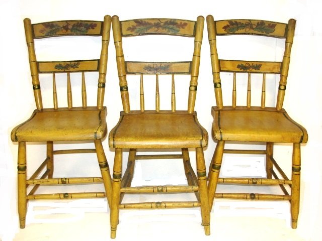 Decorated Thumb-Back Windsor Side Chairs: Late 19th. C. Bowed crest rails painted with oak leaves and acorns. on original yellow paint, turned bamboo style post half-spindle-back over a shaped seat on turned legs joined by stretchers. Conditi