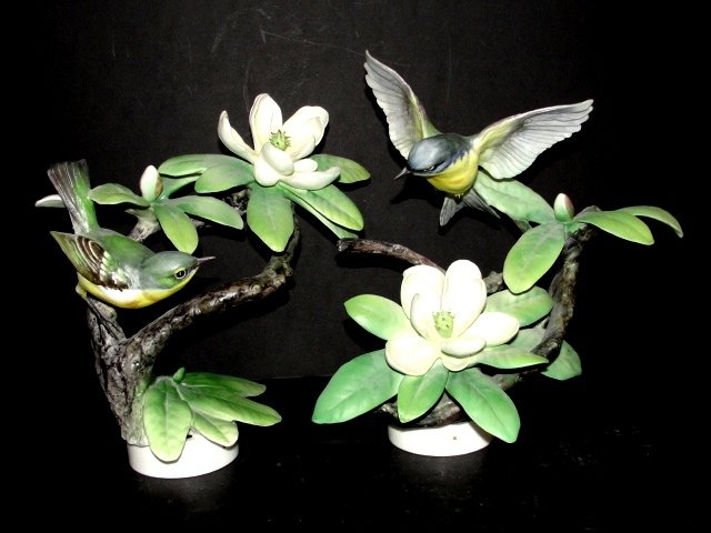 Pair Royal Worcester Porcelain Dorothy Doughty: Models of Birds, 20th century, depicting two Parula Warblers and Sweet Bay, highly realistically modeled, with gilded W on rim of bases, one perched on a branch, porcelain ht. 8 1/4, the other flying 