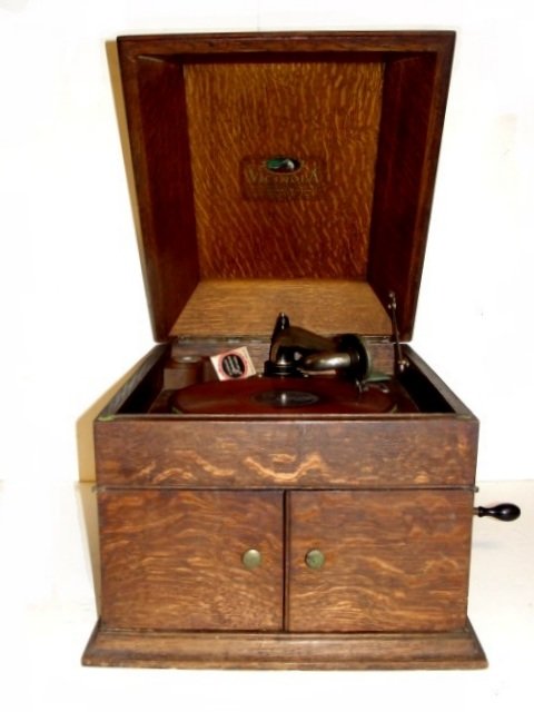 Oak Victor Victrola Table Top Talking Machine: Quarter sawn oak case with shaped top. Condition case in good old finish, mechanism needs some attention.