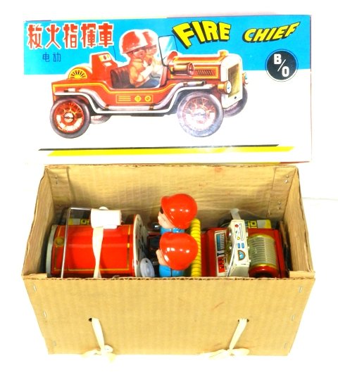 1960's BATTERY OPERATED FIRE CHIEF CAR W/BOX: New old stock here, with the metal car strapped into its original box. Incredible, bright color. Not tested.