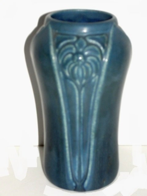 Rookwood Vase, Molded Organic Design # 2141: Rookwood Vase of ovoid form with three repeating leaf shaped panels with incised and raised molded spade shaped flower, a green/blue matte glaze , 1923, #2141. Condition very good. H. 6.1/2" Diam. 3 1