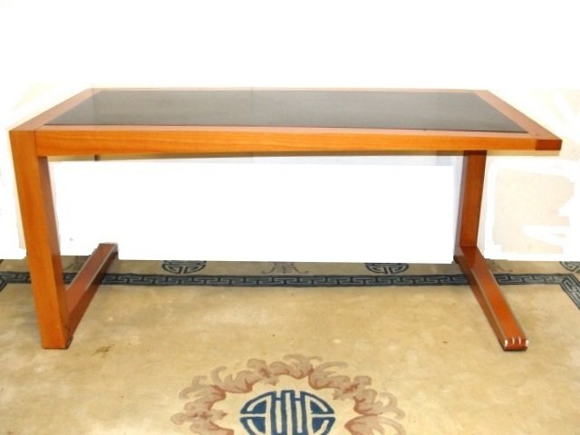 Giorgetti ZENO by Massimo Scolari Desk: A writing desk designed with the frame in polished solid beech wood, Zeno is a contemporary design with luxurious style for any home. The top is in liquid rubber or in polished ebony veneer. The base