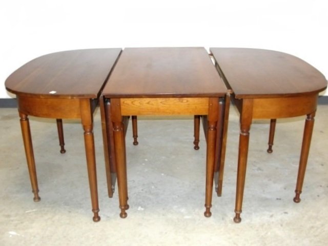 Stickley Cherry Valley 3 Part Banquet Table: Having center section with long drop leaves and two demi-lune ends. Condition very good with very light scuff mark near bottom of legs. From one owner home H. 30'' Center 23'' wide 44'' wide each drop